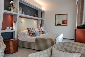 Postel nebo postele na pokoji v ubytování Hotel Hermitage