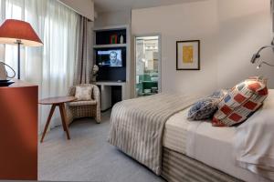 Postel nebo postele na pokoji v ubytování Hotel Hermitage