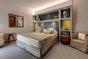 Postel nebo postele na pokoji v ubytování Hotel Hermitage
