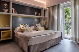 Postel nebo postele na pokoji v ubytování Hotel Hermitage