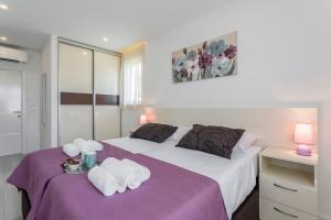 Postel nebo postele na pokoji v ubytování Apartments Villa 19