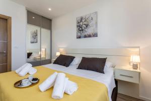 Postel nebo postele na pokoji v ubytování Apartments Villa 19