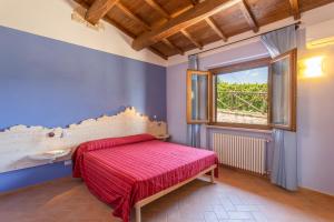 Posteľ alebo postele v izbe v ubytovaní Agriturismo Dei Casali