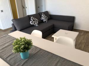 Posedenie v ubytovaní Apartamentos AR Muntanya Mar