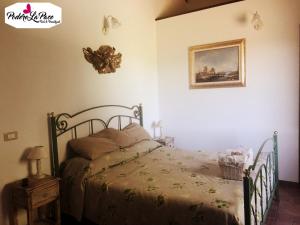 Postel nebo postele na pokoji v ubytování Podere La Pace