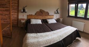 A bed or beds in a room at Las Cavernas Del Bisonte