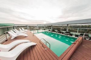 a balcony with a swimming pool on a cruise ship at Mérit Iguazú Hotel in Puerto Iguazú
