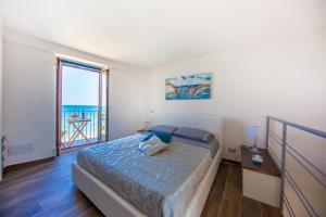 A bed or beds in a room at Marechiaro House
