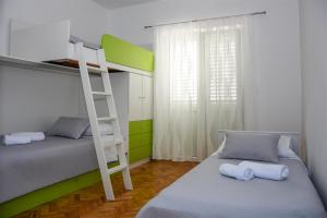 Postel nebo postele na pokoji v ubytování Crnika