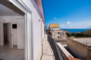 a balcony with a view of the ocean at Mariú Rooms in Castellammare del Golfo