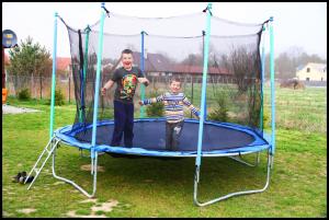 a man and a boy on a trampoline at PRZYSTAŃ CISZY in Jantar +49 photos