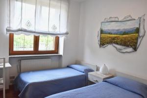 Un pat sau paturi într-o cameră la Al Vecchio Glicine
