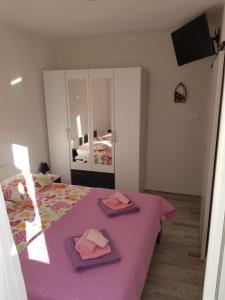 Postel nebo postele na pokoji v ubytování Apartments Centar - Mirjana