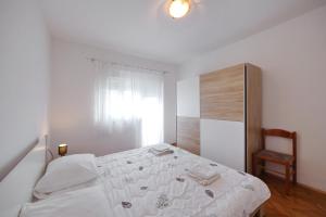 Postel nebo postele na pokoji v ubytování Apartment Mirela