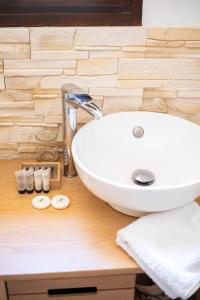 a white sink sitting on top of a wooden counter at Lyon Mon Amour B&B in Lyon