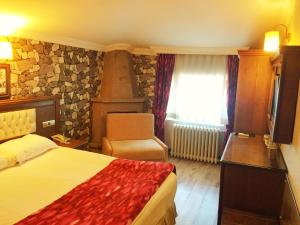 Postelja oz. postelje v sobi nastanitve Assos Kervansaray Hotel - Special Category