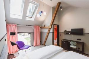Hotel am Kloster - Domäne Möllenbeck tesisinde bir odada yatak veya yataklar