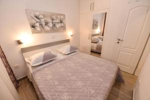 Postel nebo postele na pokoji v ubytování Apartment Cecilija