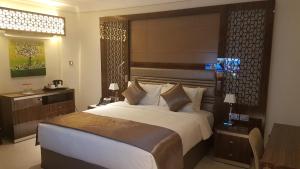 A bed or beds in a room at Tio Sea Resort