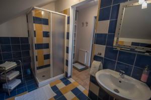 a bathroom with a sink and a shower at apartma mojca in Bohinj +17 photos