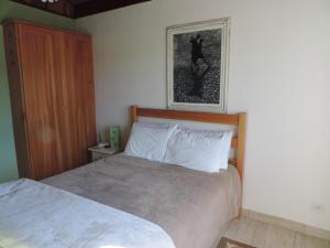 Postel nebo postele na pokoji v ubytování Refugio Fofo - casa de temporada