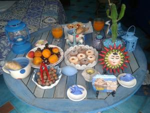 a table with a bunch of food on it at Casa il Soffio di Eolo in Scilla