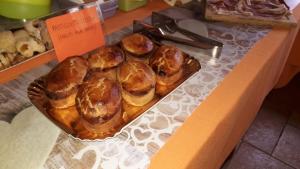 a tray of pastries on a counter in a bakery at B&B Il Casolare in Sant'Isidoro