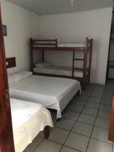 Postel nebo postele na pokoji v ubytování Hotel Pousada Hamburgo