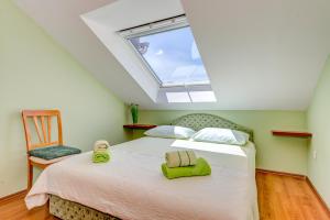 a bedroom with a bed and a window at Natali in Omiš