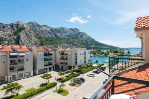 arial view of a building with mountains in the background at Natali in Omiš