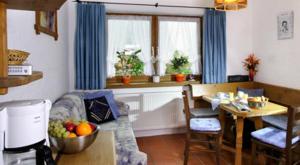 a living room with a couch and a table at Landsitz im Reitle in Längenfeld