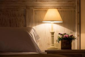 Postel nebo postele na pokoji v ubytování Hotel La Posada De Alameda