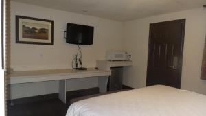 Postel nebo postele na pokoji v ubytování Del Rancho Motel
