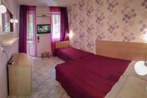 Postel nebo postele na pokoji v ubytování Rilena Hotel