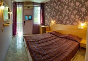 Postel nebo postele na pokoji v ubytování Rilena Hotel