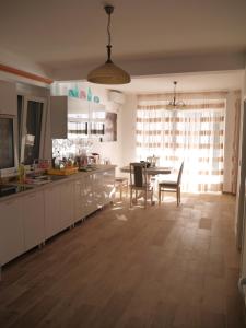 a kitchen and dining room with a table and chairs at CrystalSky in Dobra Voda