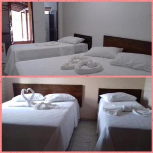 two beds with white sheets and towels on them at Hotel Mirante do Vale in Itabaiana