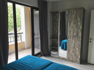 a bedroom with a mirror and a bed at Azzurro Apartment - ideal for your seaside escape in Burgas in Burgas