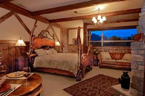a bedroom with a large bed and a large window at Adobe Grand Villas in Sedona