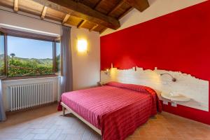 Posteľ alebo postele v izbe v ubytovaní Agriturismo Dei Casali