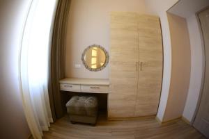 a dressing room with a mirror and a cabinet at Ana's Apartment in Old Tbilisi in Tbilisi City