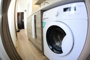 a washing machine sitting inside of a house at Ana's Apartment in Old Tbilisi in Tbilisi City