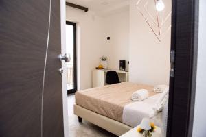 Postel nebo postele na pokoji v ubytování Albergo Milazzo Inn AiMori