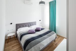Кровать или кровати в номере Apart Hotel Code 10