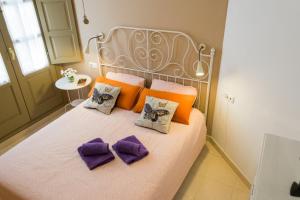 Posteľ alebo postele v izbe v ubytovaní MALAMA Apartamentos Turísticos