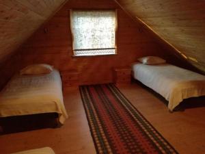 מיטה או מיטות בחדר ב-Ala Juusa Holiday Home