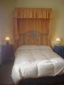 Postel nebo postele na pokoji v ubytování Posada del Angel