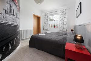 Łóżko lub łóżka w pokoju w obiekcie Morskie Apartamenty "Zefir" "Notos" "Loft" "Gniazdo"
