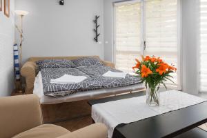 Łóżko lub łóżka w pokoju w obiekcie Morskie Apartamenty "Zefir" "Notos" "Loft" "Gniazdo"