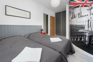 Łóżko lub łóżka w pokoju w obiekcie Morskie Apartamenty "Zefir" "Notos" "Loft" "Gniazdo"